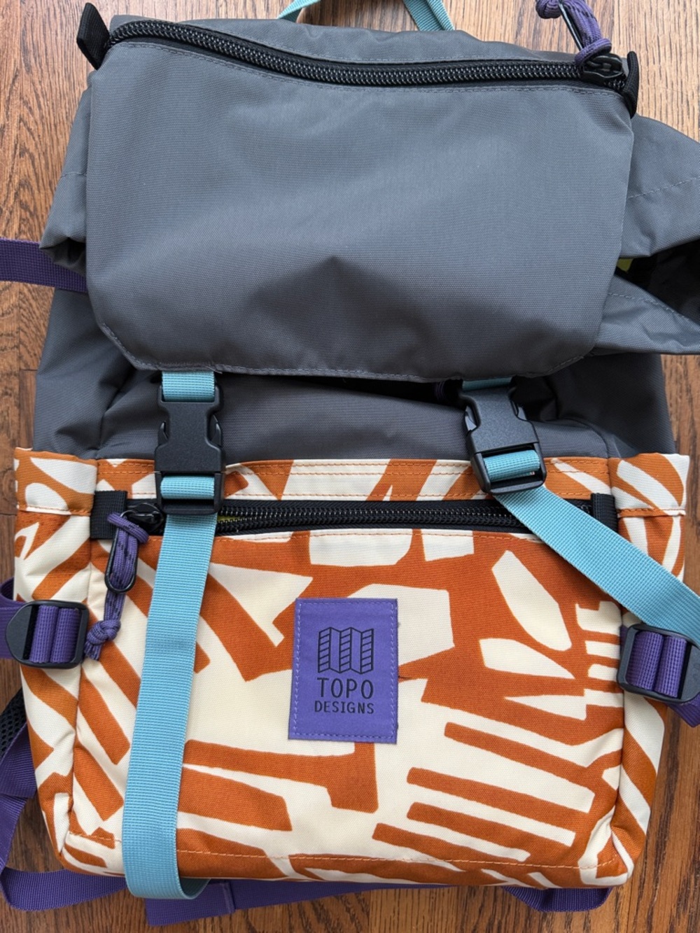 Topo Designs Gray & Rust Patterned Canvas Backpack with Purple Logo